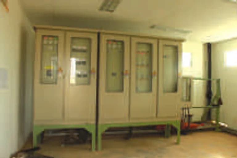 Row of electrical automation and control panel cabinets.