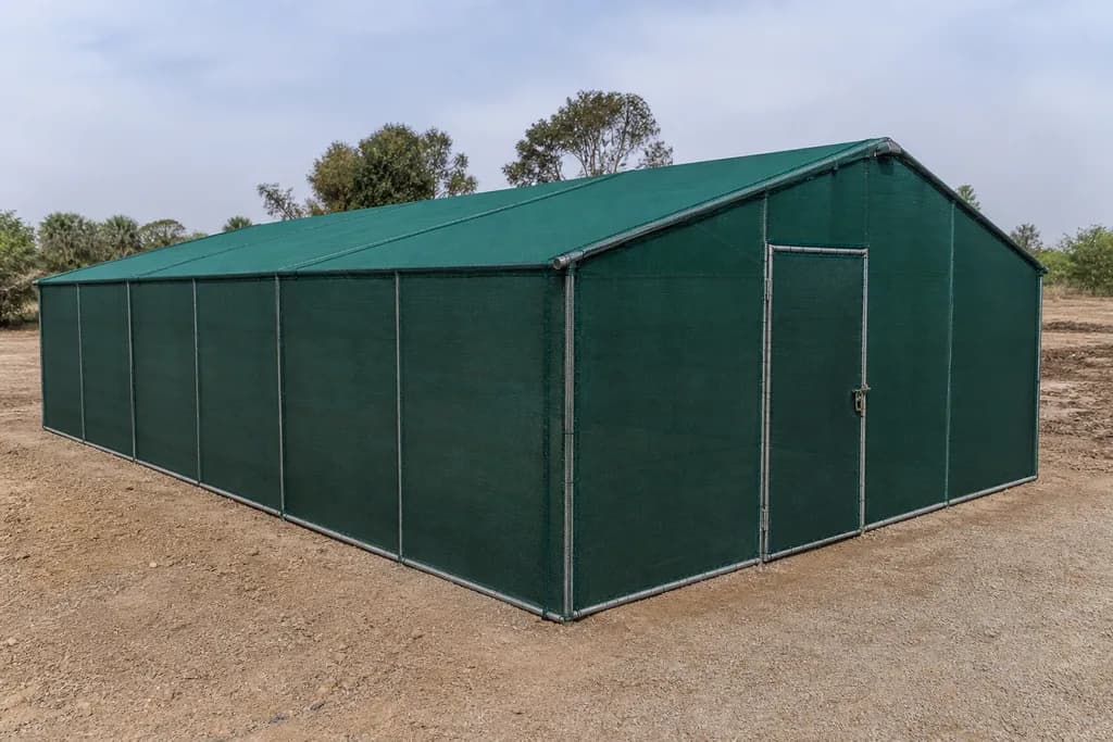 Illustrative rendering of a shade house structure under green shade cloth.